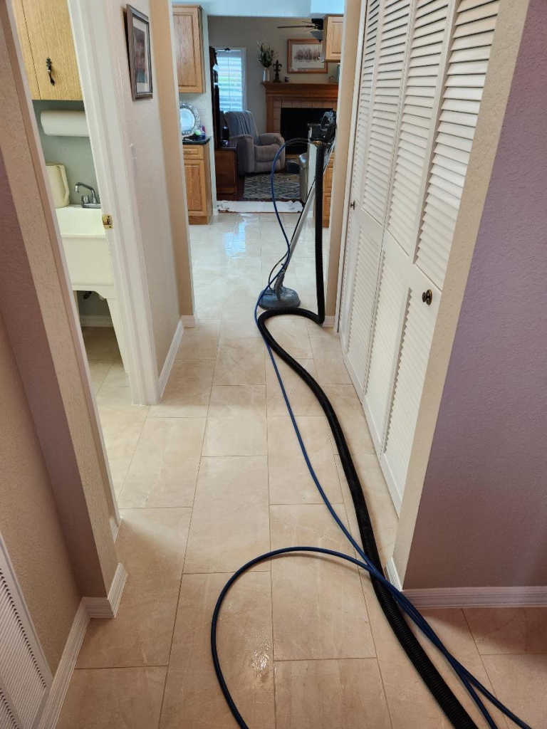 An image of tiles being professionally cleaned with a machine