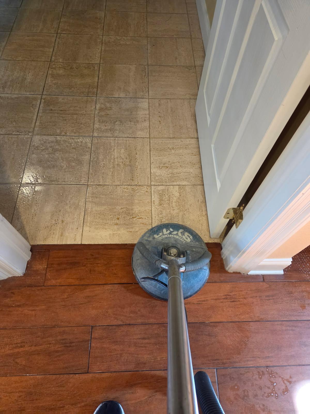 close-up of grout lines on the floor being cleaned using a professional scrubber