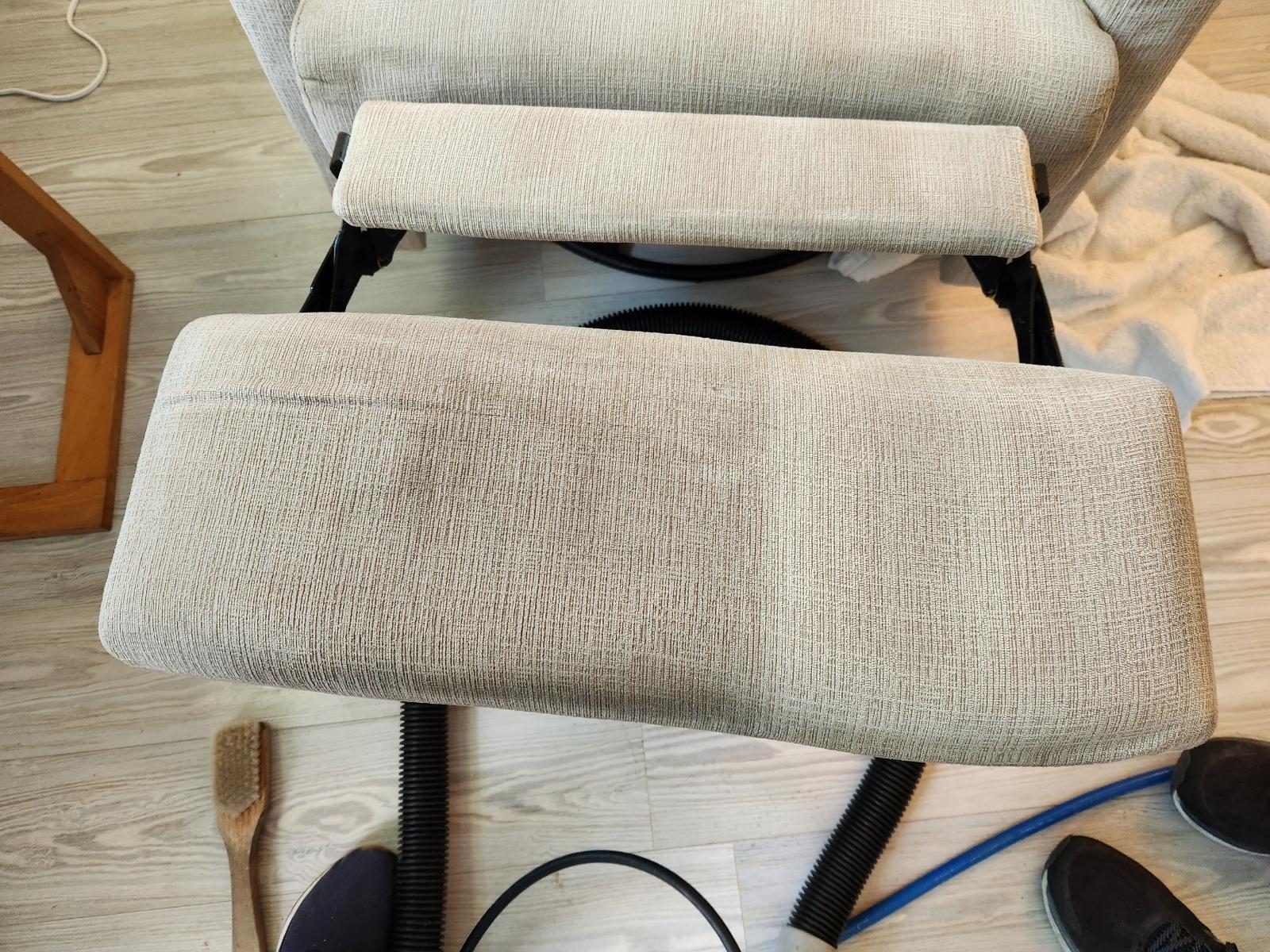 close-up of a footrest on a chair with half clean and half dirty to show comparison
