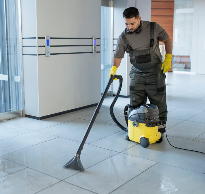 https://steambritecarpetcleaning.com/wp-content/uploads/2023/04/full-shot-man-vacuuming-office-floor-pic.jpg