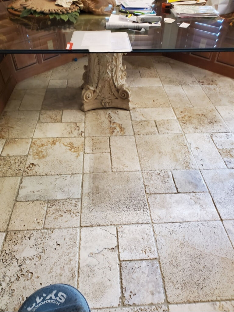 Stone floor with heavy wear and tear