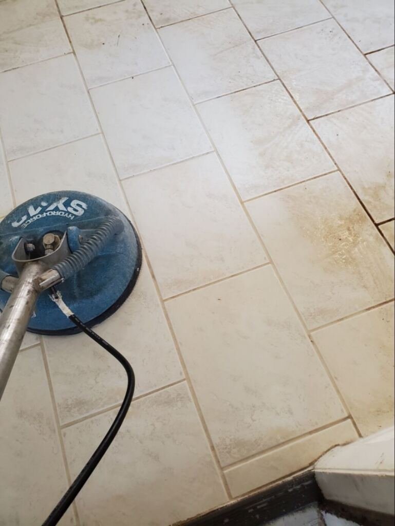 A tile and grout cleaning underway