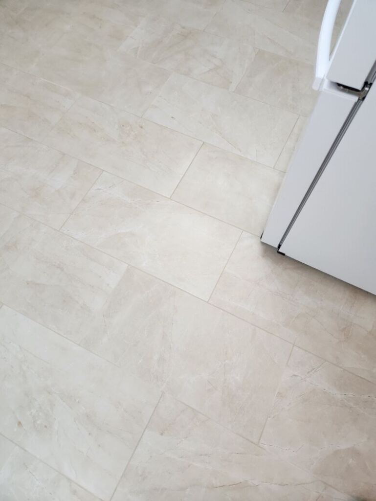 A kitchen tile floor after professional cleaning