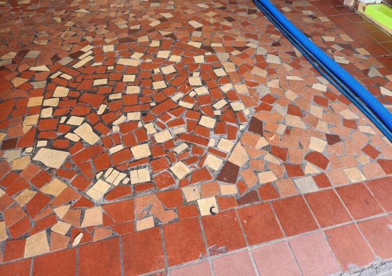 Dirty stoned floor that requires immediate deep clean 