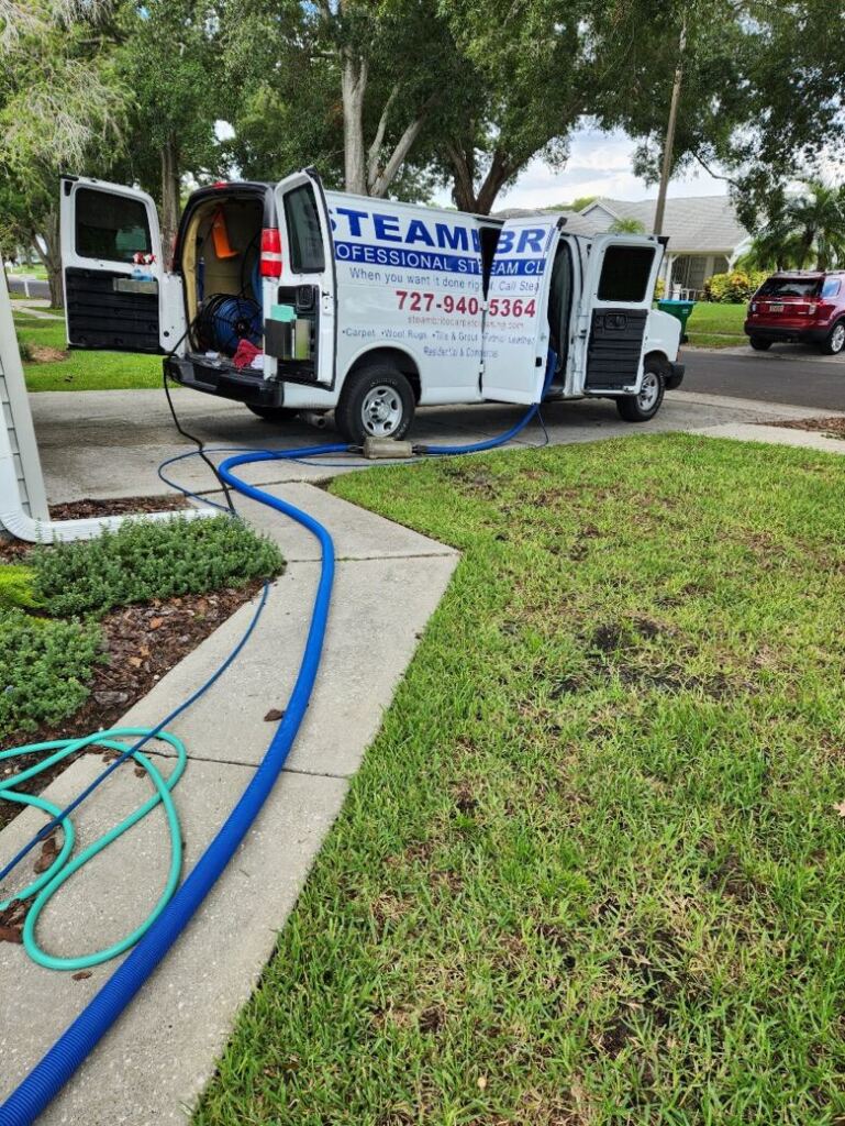 Steambrite cleaning service truck at a job site