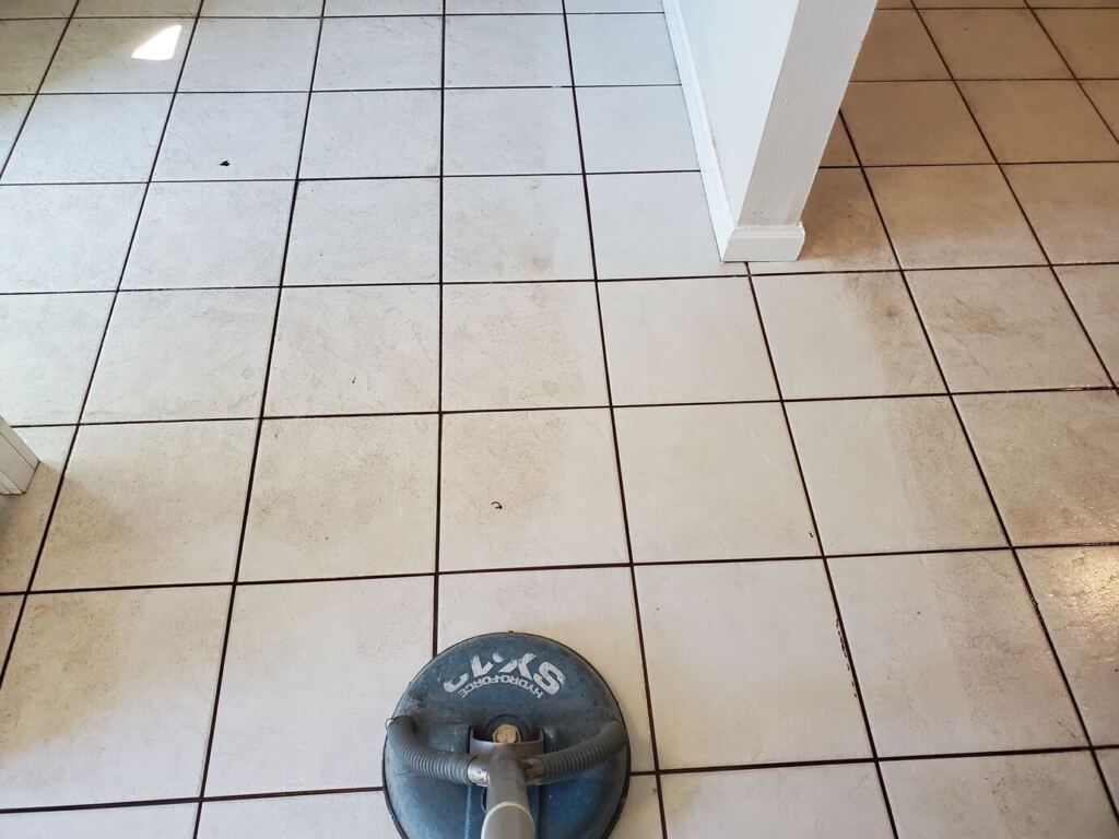 Steam tile cleaning equipment on dirty tiles