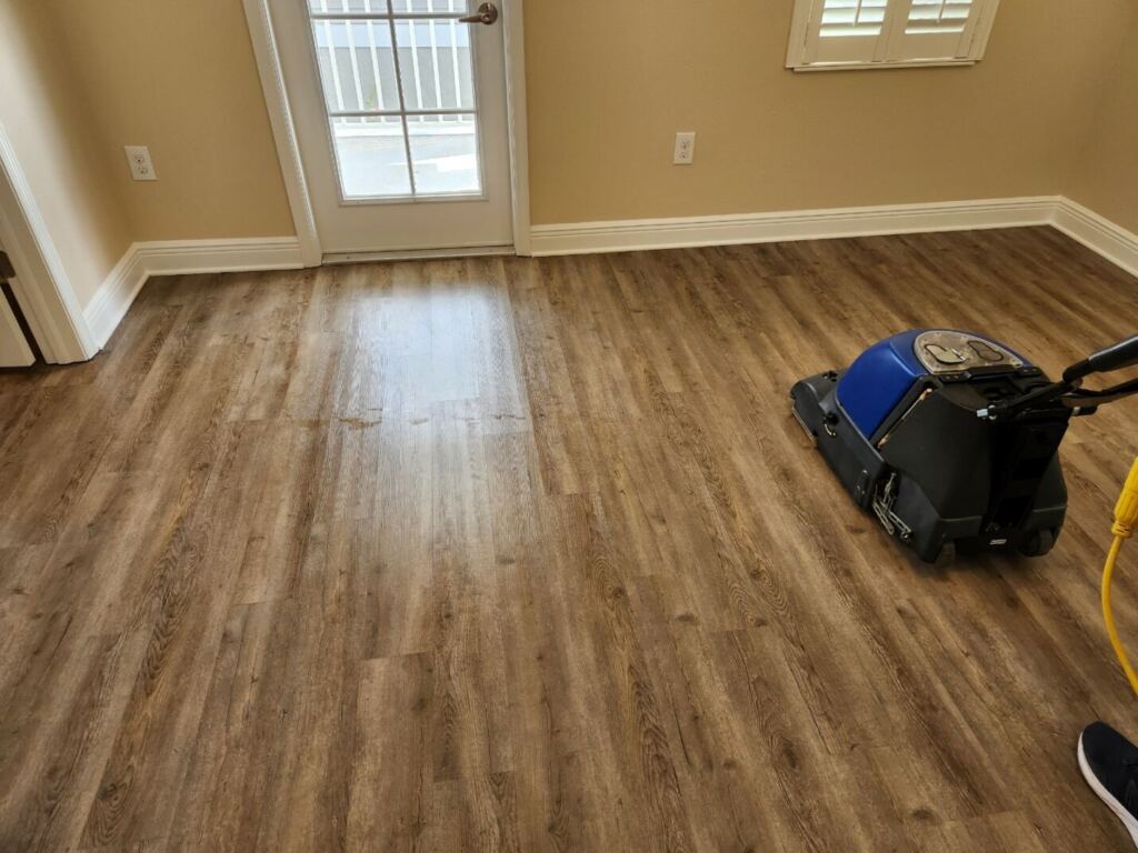 laminated wood floor getting cleaned