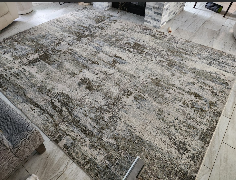 Clean decorative rug placed on a floor inside a home.