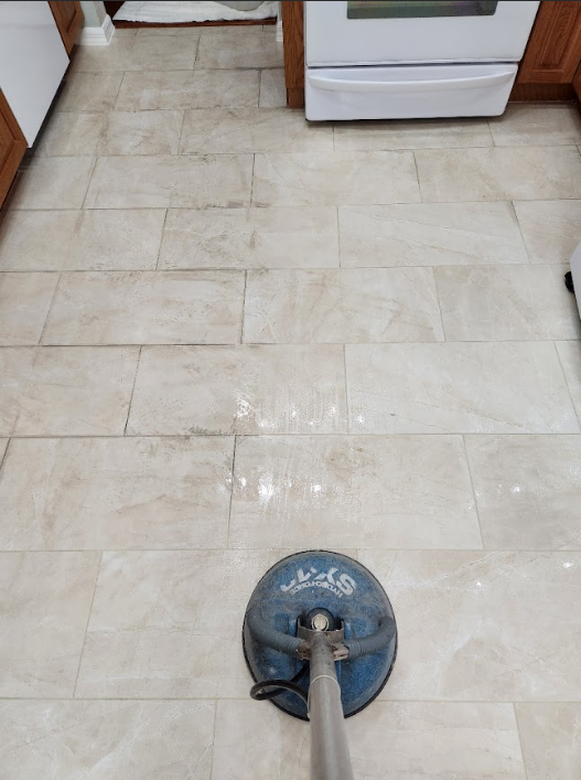 Tile floor undergoing deep cleaning.