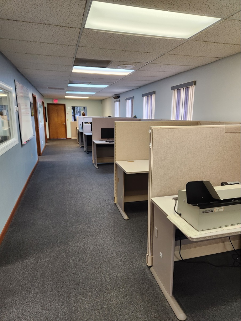 Commercial office workspace with carpeted floors ideal for professional carpet cleaning and maintenance services.