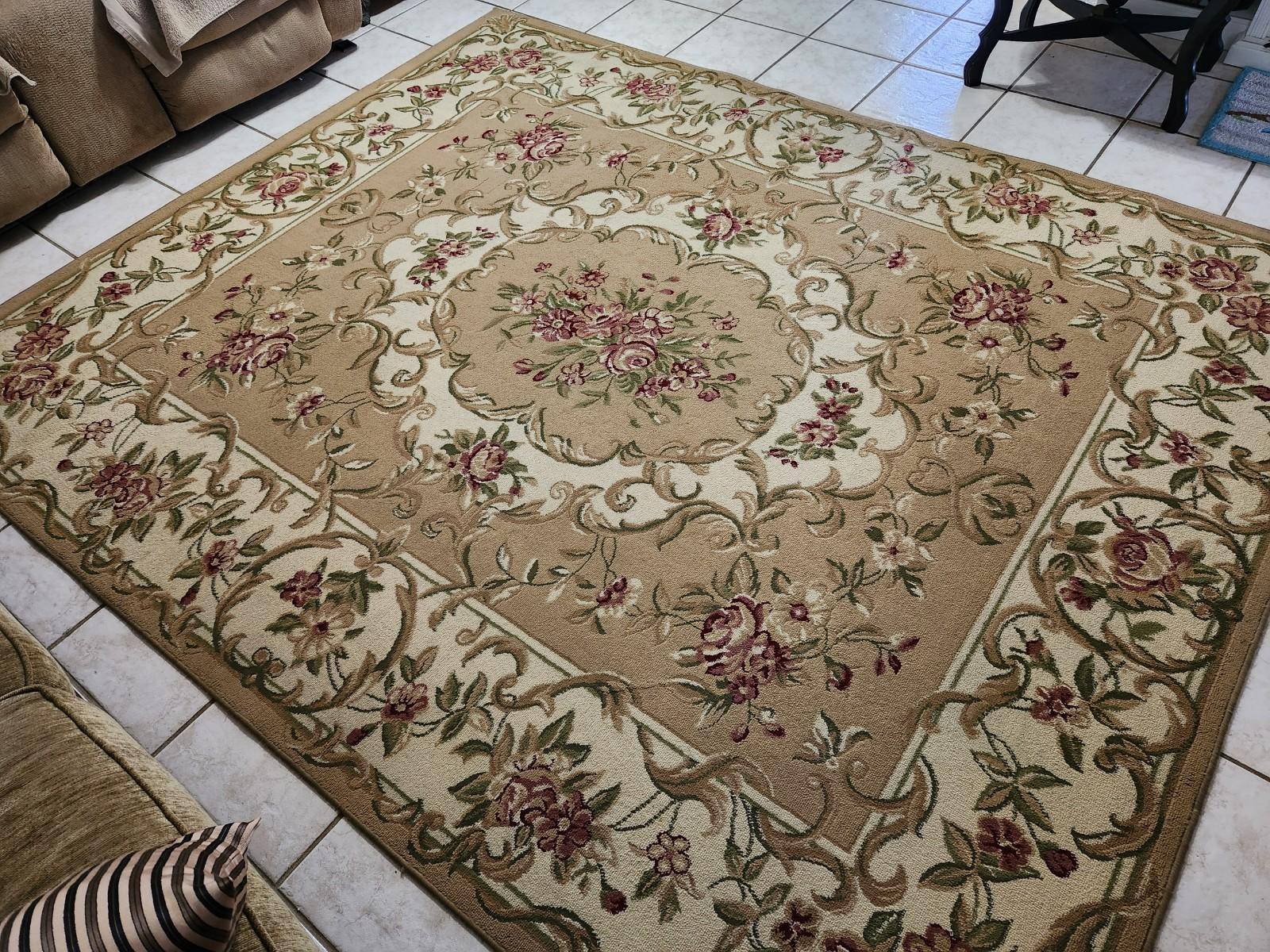 a rug placed on a tiled floor