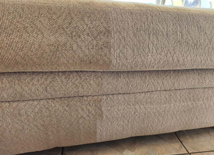  Close-up of beige sofa upholstery showing freshly cleaned fabric texture