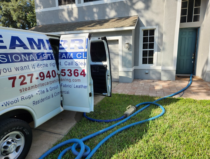 Steambrite Cleaning Services van providing rug cleaning services