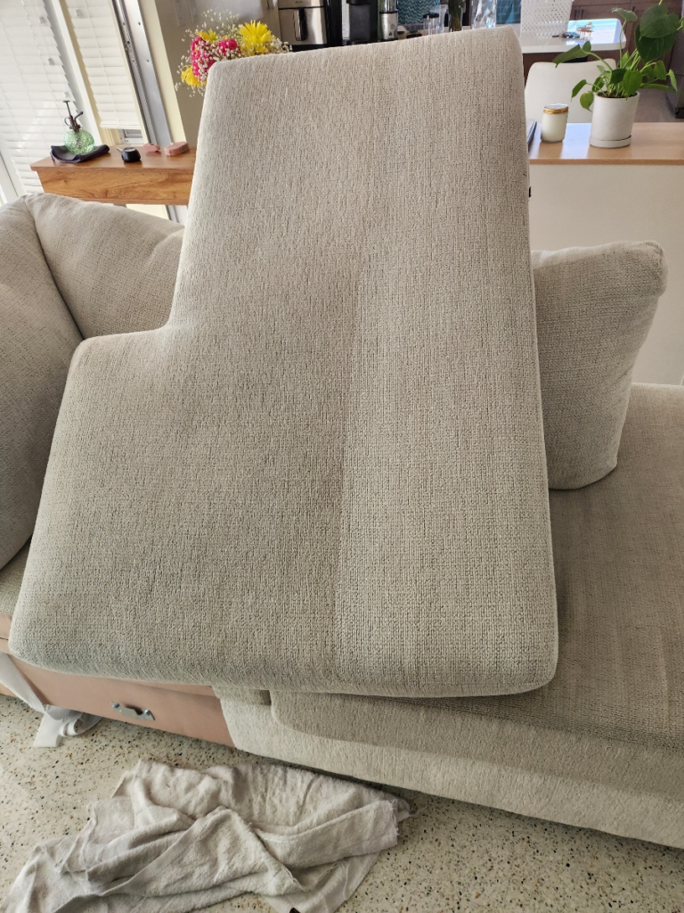 close-up of a sofa cushion removed from the sofa for cleaning
