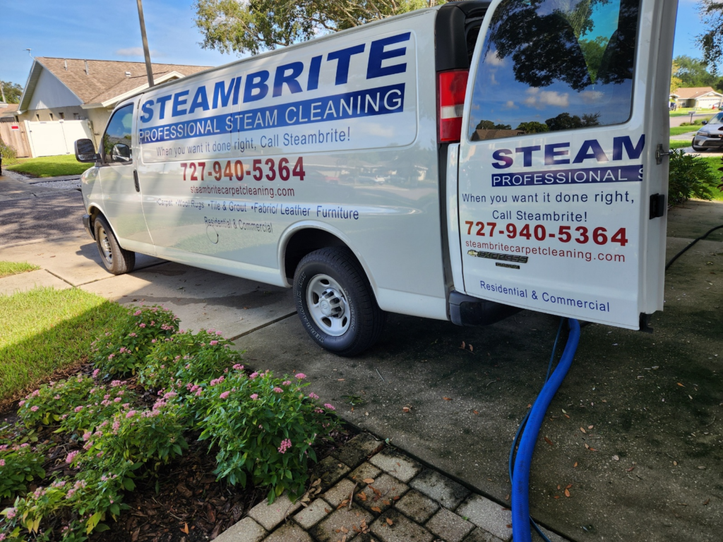 Steambrite Cleaning Services van outside a house