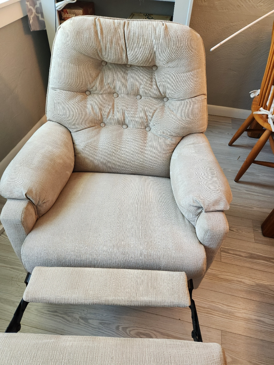 a grey armchair placed for cleaning