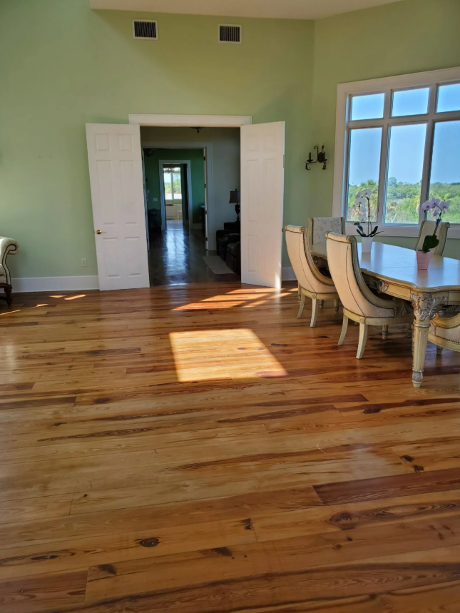 clean hardwood floors in a sunny dining room