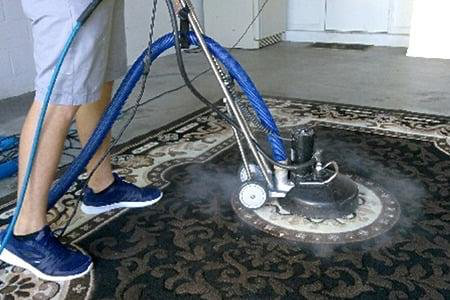 in-home area rug cleaning with professional steam equipment