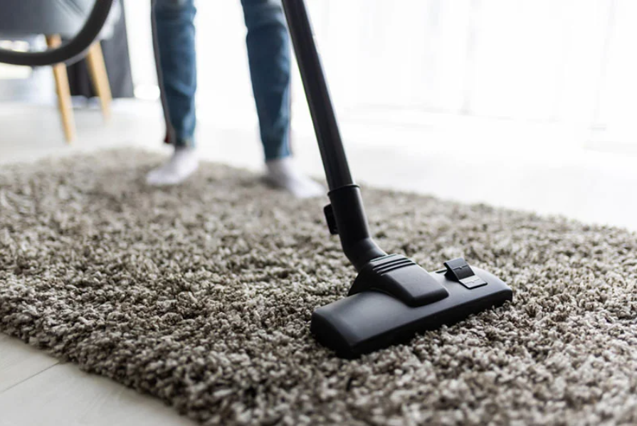 vacuum cleaning a wool rug at home
