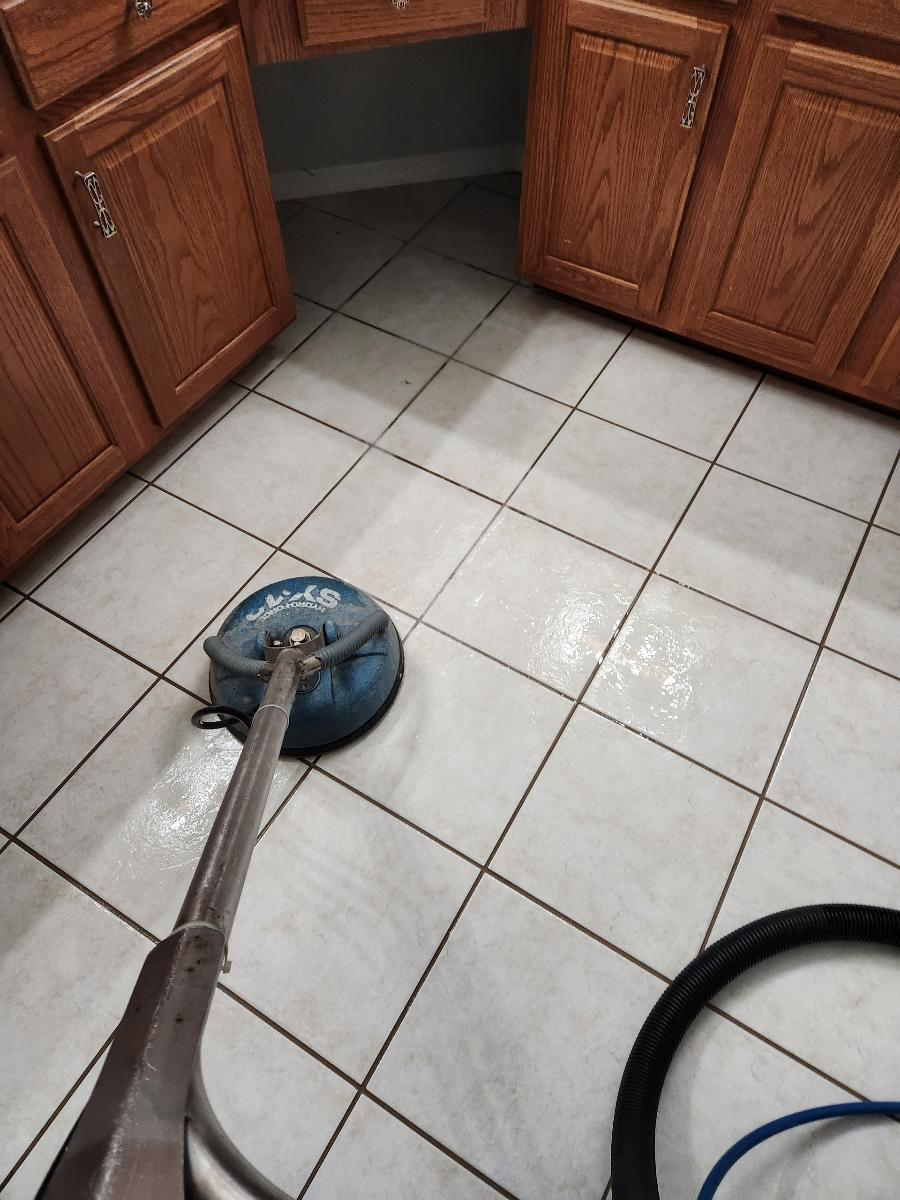 An image of tile and grout being cleaned