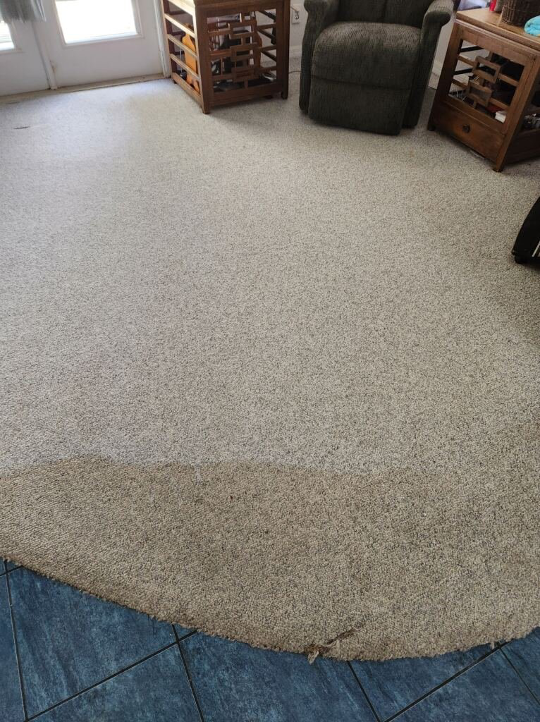 A dirty carpet on the floor. 