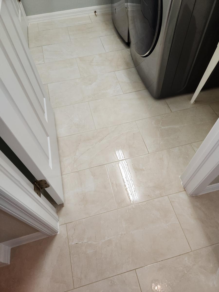 close-up of clean white tiles in the laundry room of a house