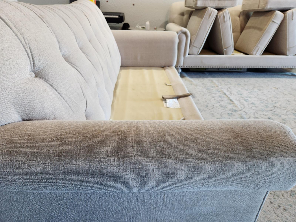 An image of sofa cushions removed for cleaning